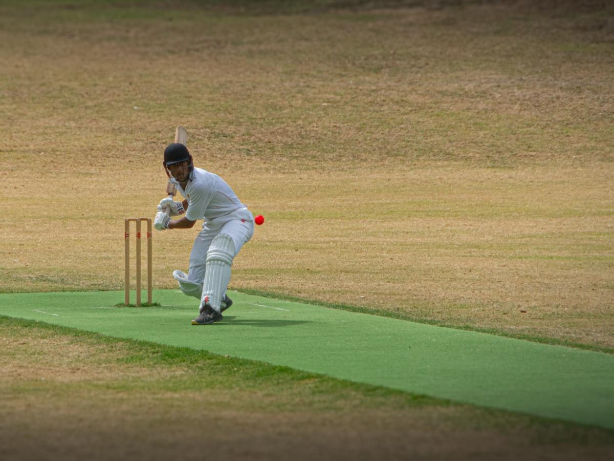 A cricket match in progress on a field