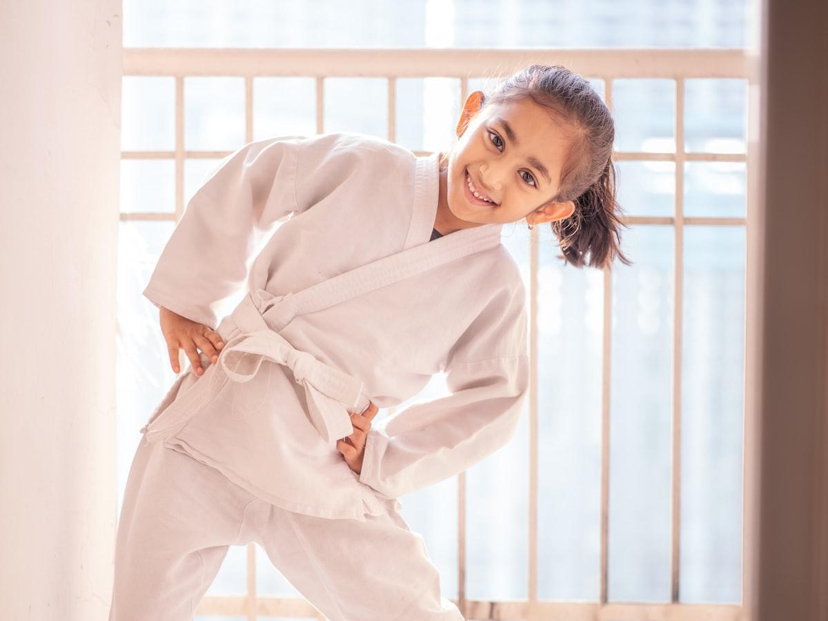 A young karate student in a white gi