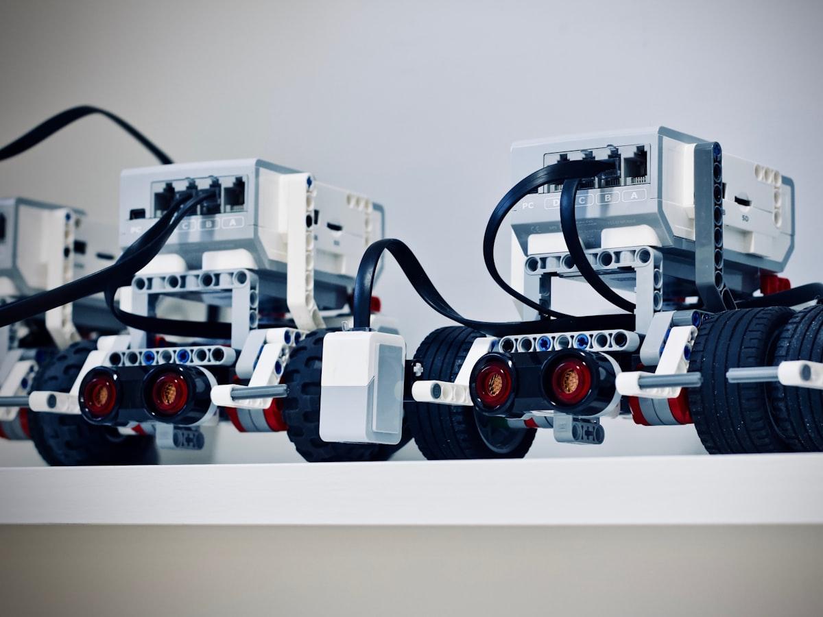 A wheeled robot being built on a desk